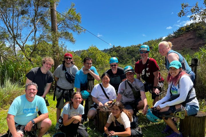 a group of people sitting at a park